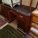 An Edwardian mahogany knee-hole writing desk, with fitted drawers and cupboards, W130cm