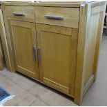 A modern oak side cabinet, with fitted drawers and cupboards under, W90cm