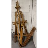 A pair of pine floor standing artist's easels, and 2 folding artist's easels
