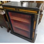 A Victorian ebonised and satinwood-banded pier cabinet, with single glazed door and ormolu mounts,
