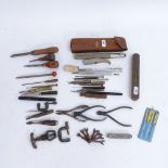 Various watchmaker and craft tools, including levels and G-clamps