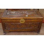 A Chinese camphorwood blanket chest, with allover relief carved decoration, W89cm