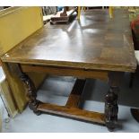 A French parquetry-topped oak draw leaf dining table, with carved figural legs, on H-shaped