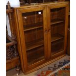 An Ercol Windsor bookcase, 2 glazed doors, W91cm