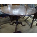 A Georgian mahogany circular table on tripod base, W91cm