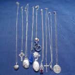 A collection of silver necklaces, pendants, rings etc