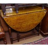 An oak oval gateleg table on baluster legs, W90cm