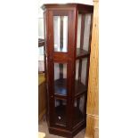 A modern hardwood and glazed octagonal display cabinet, H182cm