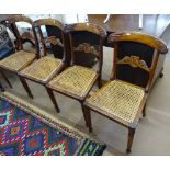 A set of 4 Regency mahogany and cane-seated dining chairs, with armorial carved backs