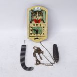 A Vintage German hanging cat clock, moving eyes with pine cone weight and tail pendulum, dial height