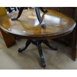 A Victorian walnut and marquetry decorated oval loo table, on a quadruple sabre leg base, W114cm