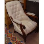A William IV mahogany open armchair, with button-back upholstery on turned legs