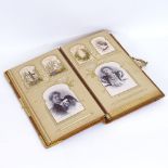 A Victorian felt-bound family photograph album, gilt-metal mounts and mostly full, album length 35cm