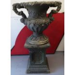 A large and impressive concrete 2-handled garden urn, with embossed acanthus leaf and grape