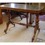 A Victorian walnut stretcher table, with tooled leather top, on carved legs, W91cm