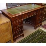 A reproduction mahogany twin-pedestal writing desk, with fitted drawers, W120cm