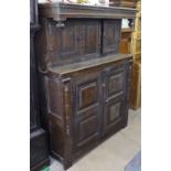A large Antique joined oak 2-section Court cupboard, with fielded panelled cupboard doors, W136cm,