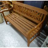A stained hardwood slatted garden bench, L139cm