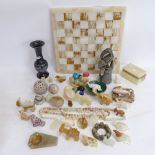 A collection of various hardstone carvings, including malachite bowl, Deco style onyx ashtray, and