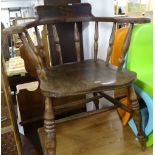 An elm-seated smoker's bow armchair