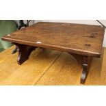 An Arts and Crafts oak low stand with pierced supports, W60cm