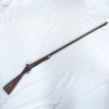 A 19th century percussion musket rifle, brass strapwork and ram rod, with indistinct engraved