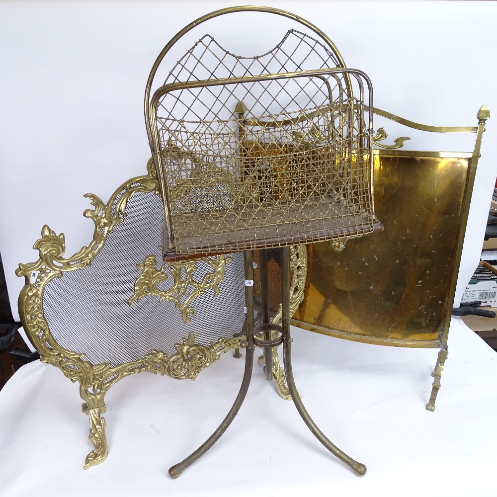 2 brass fire screens, and a brass-framed magazine rack, largest screen height 68cm (3)