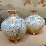 A pair of Japanese vases on tripod supports, height 20cm, a pair of jars and covers, and a