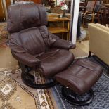 An Ekornes Stressless brown leather-upholstered swivel reclining armchair and matching footstool