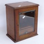A 19th century oak table-top smoker's cabinet, with interior drawer and pipe rack, height 30cm