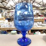 A blue glass vase on pedestal, 43cm