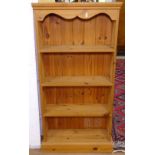 A modern narrow pine open bookcase, W60cm
