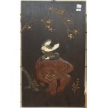 An Oriental stained and gilded wood wall panel, depicting bone applied figure riding a mythical