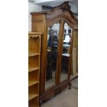 An Antique Continental walnut armoire, with 2 bevelled-glazed doors, W140cm, H265cm