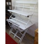 A white painted slatted-top folding garden table, together with a pair of matching chairs and