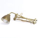 A Victorian brass wall-mounted swivel lamp, enamelled shade, extended arm length 90cm