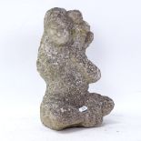An Oriental carved stone seated figure with monkey, height 32cm