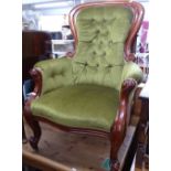 A Victorian mahogany-framed and button-back upholstered armchair