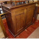 A Victorian oak filing cabinet, the 2 panelled doors opening to reveal a fitted interior, W105cm,