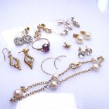 An assorted group of 9ct gold jewellery, mainly to include earrings and a stone set ring, 9.2g