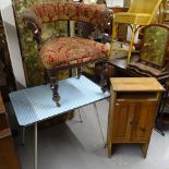 A mid-century melamine-top kitchen table, pine cabinet, and a 19th century bow-arm chair