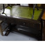 A 1920s oak writing desk with 2 frieze drawers