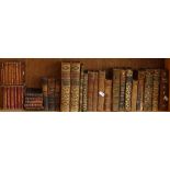 Various leather-bound books, including Butlers Hudibras Fables De La Fontaine etc