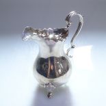A modern silver cream jug on hoof feet, London 1989, 5.9oz