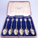 A cased set of 6 silver-gilt presentation spoons, depicting King's of Britain 1936, George V, Edward