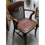 A 1920s oak desk chair