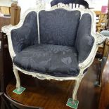 A Continental style painted and silvered upholstered armchair
