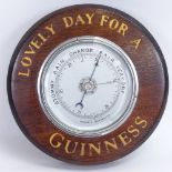 A Vintage Guinness wall hanging mahogany advertising aneroid barometer, diameter 21cm