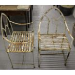 A pair of wrought-iron Gothic garden chairs, with lancet backs, in the Regency manner