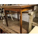 A 1920s oak Cotswold School style draw leaf dining table